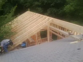 Framing a new roof addition that ties into an existing shingle roof in East Bend